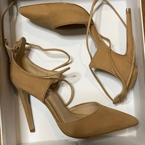 Tan lace up pointed toe heels.